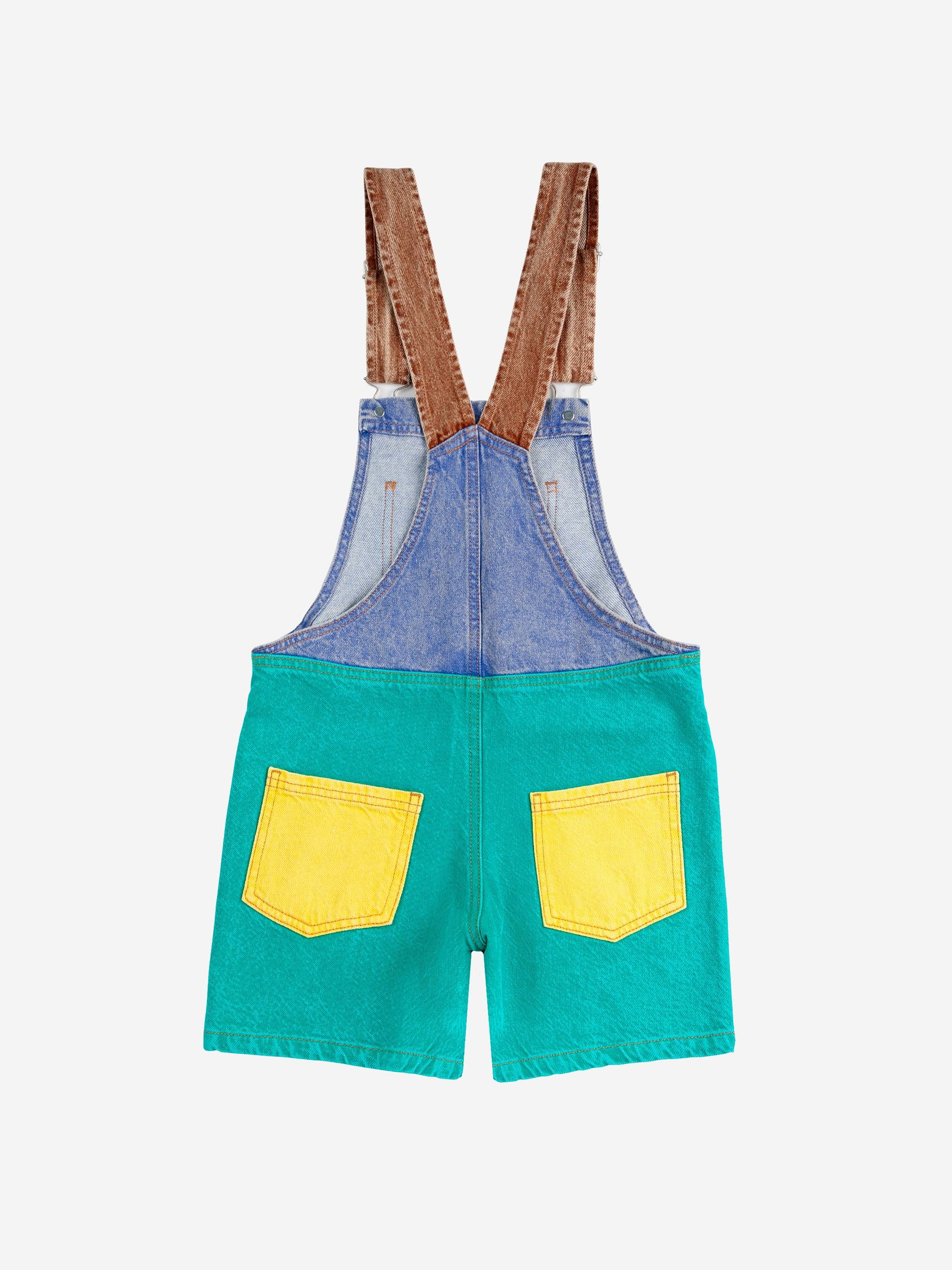 Rückansicht des Smiling Color Block Denim Dungaree mit gelben Gesäßtaschen und verstellbaren Trägern, perfekt für Kinder von 4 bis 12 Jahren.