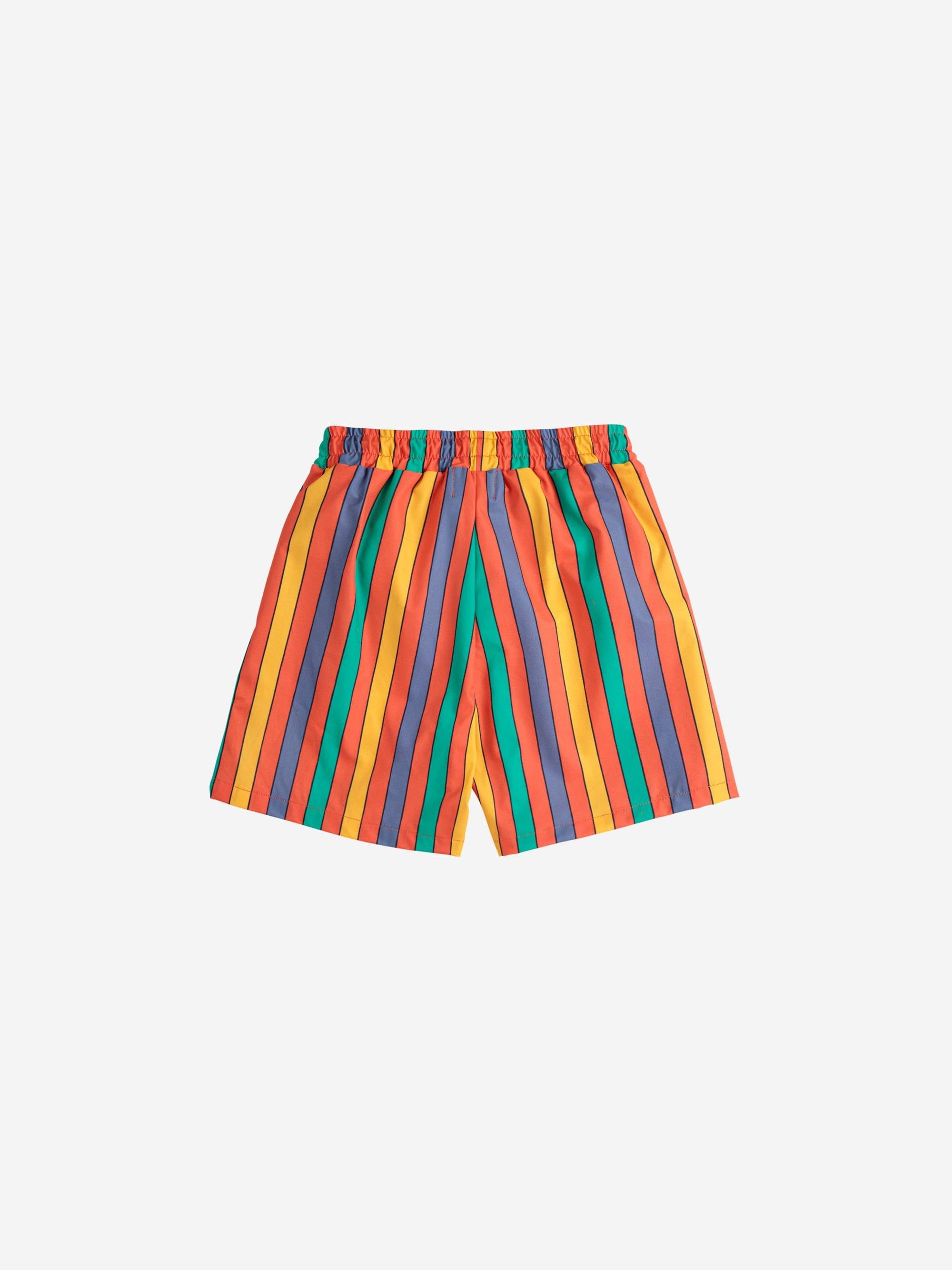 Rückansicht der farbenfrohen Multicolor Stripes Swim Shorts aus der Bobo Choses SS25 Linie, perfekt als bequeme Badeshorts für Jungen und Mädchen.