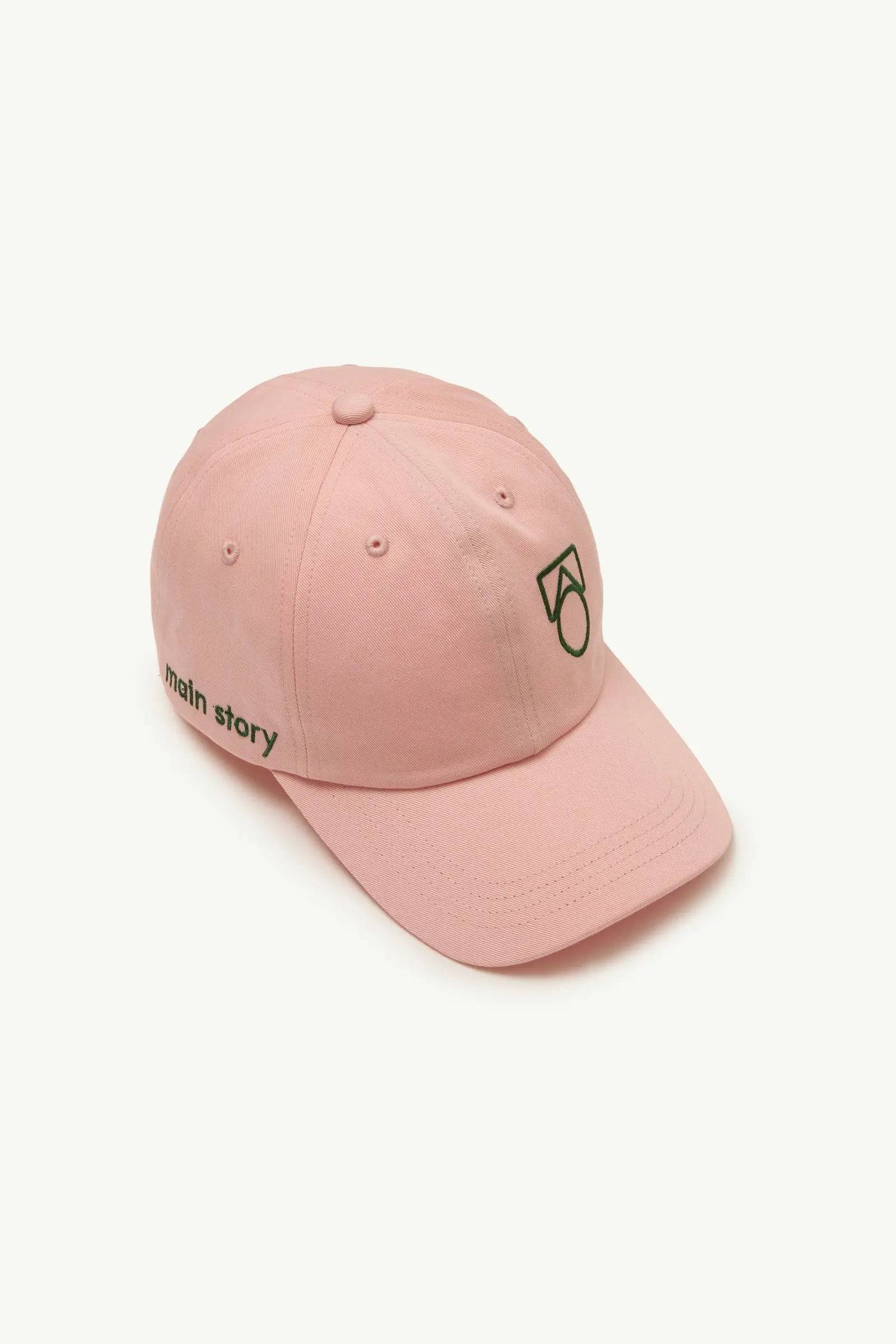 Cap Peach Twill in Rosa mit grünem Logo-Stick auf der Vorderseite, verstellbar und ideal für Jungen und Mädchen im Outdoor-Bereich.