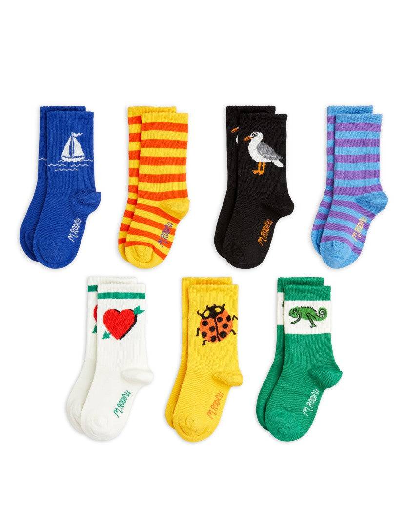 Seagull 7-Pack Socks von Mini Rodini mit bunten Motiven wie Möwe, Marienkäfer und Herz, ideal für Kindergrößen 28–39.