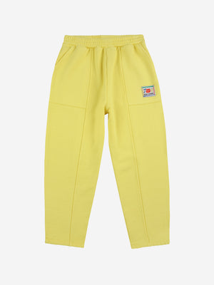 Smiling yellow jogging pants