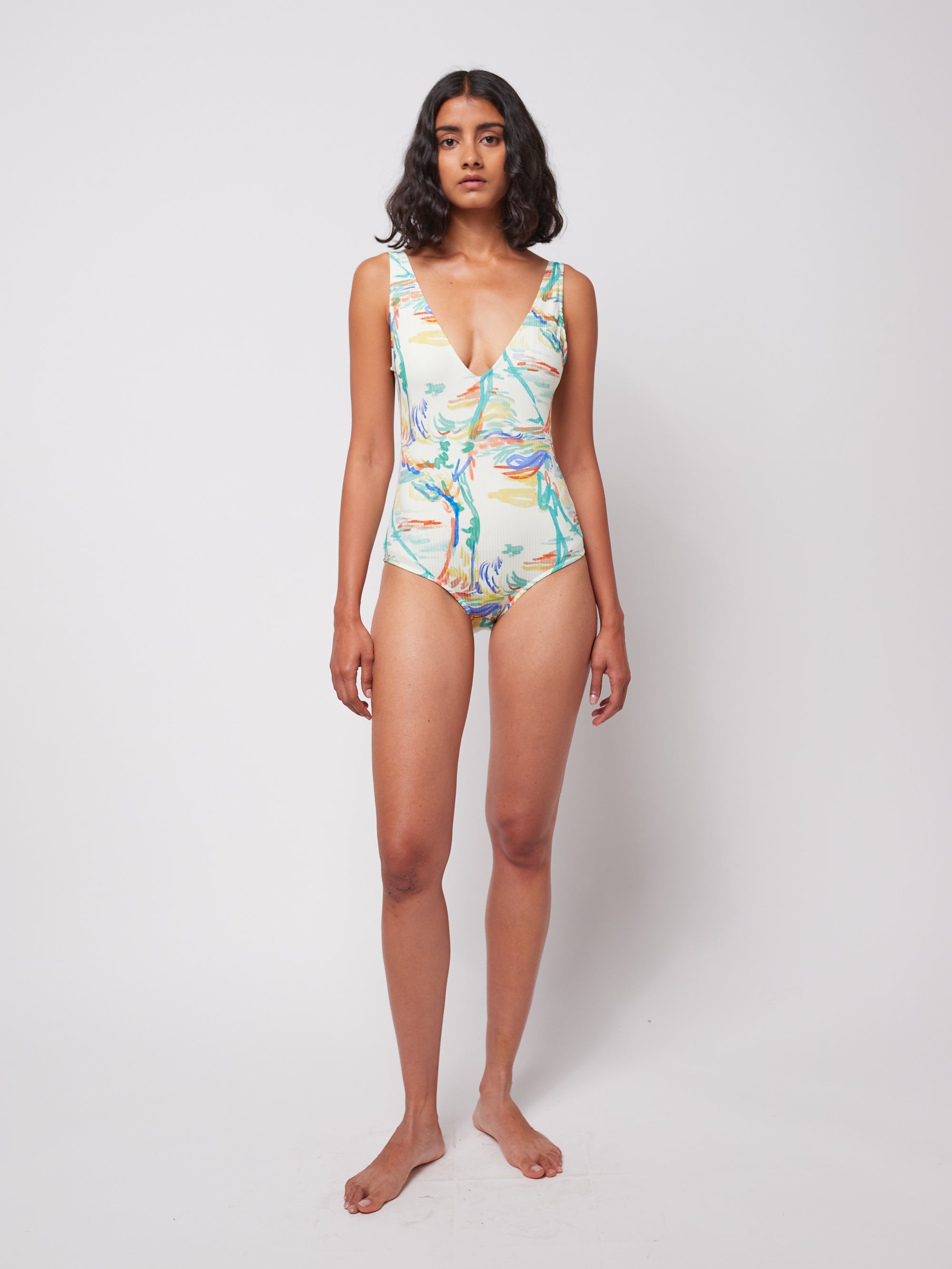 Spring Landscape Swimsuit with ribbed V-neck design, featuring a colorful abstract print. Made from 50% cotton and 50% recycled material for eco-friendly swimwear.