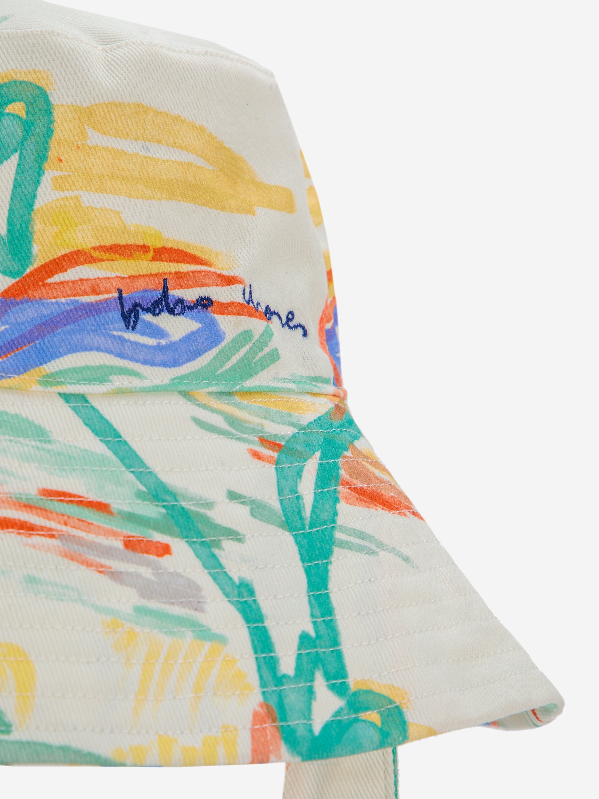 Close-up of the Landscape Print Canvas Hat featuring an embroidered logo and vibrant artistic design. A unique and timeless accessory.