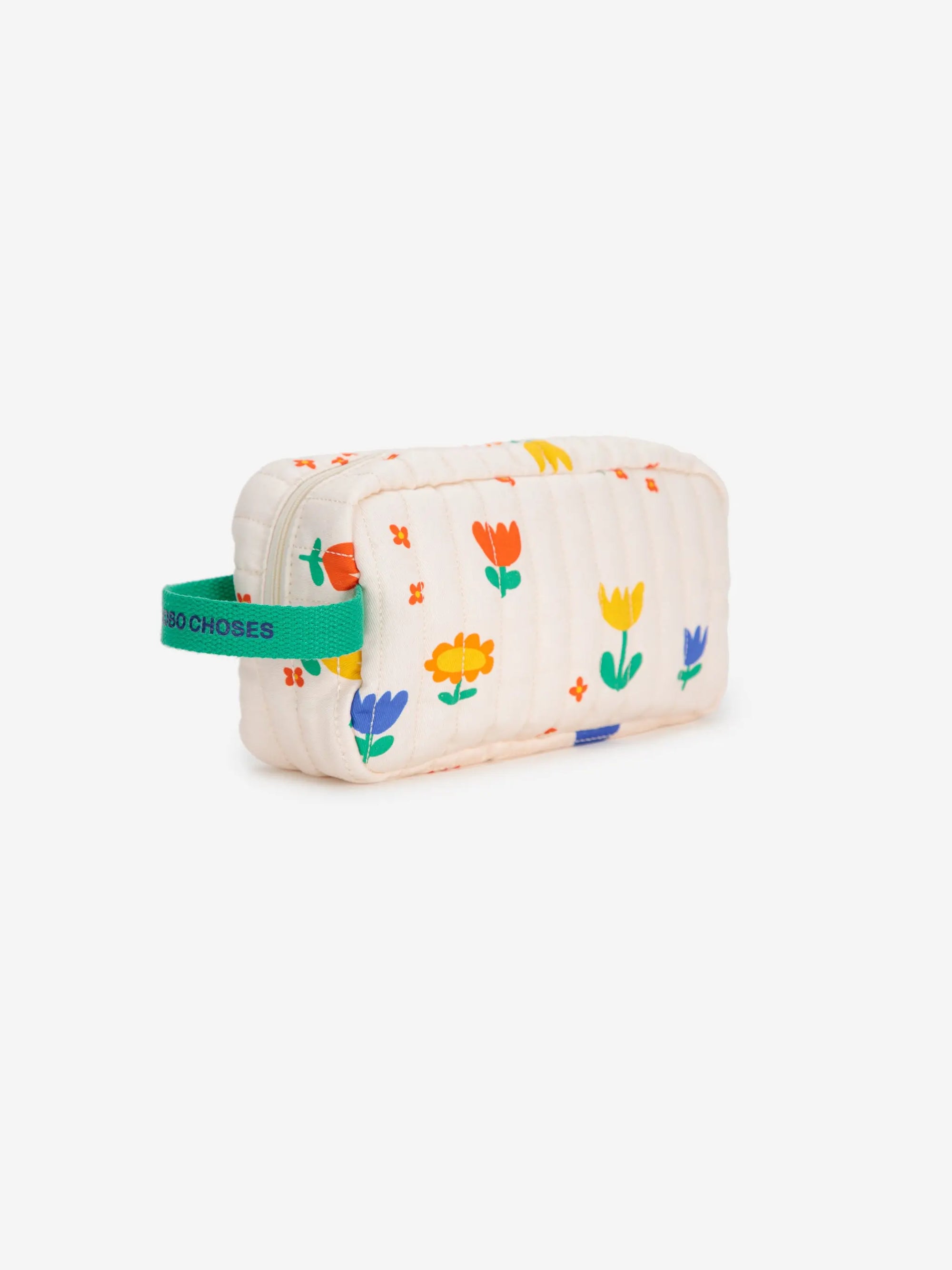 Side view of the Garden Party Belt Pouch from Spain, showcasing its soft quilted texture, floral pattern, and sturdy green handle for easy carrying.