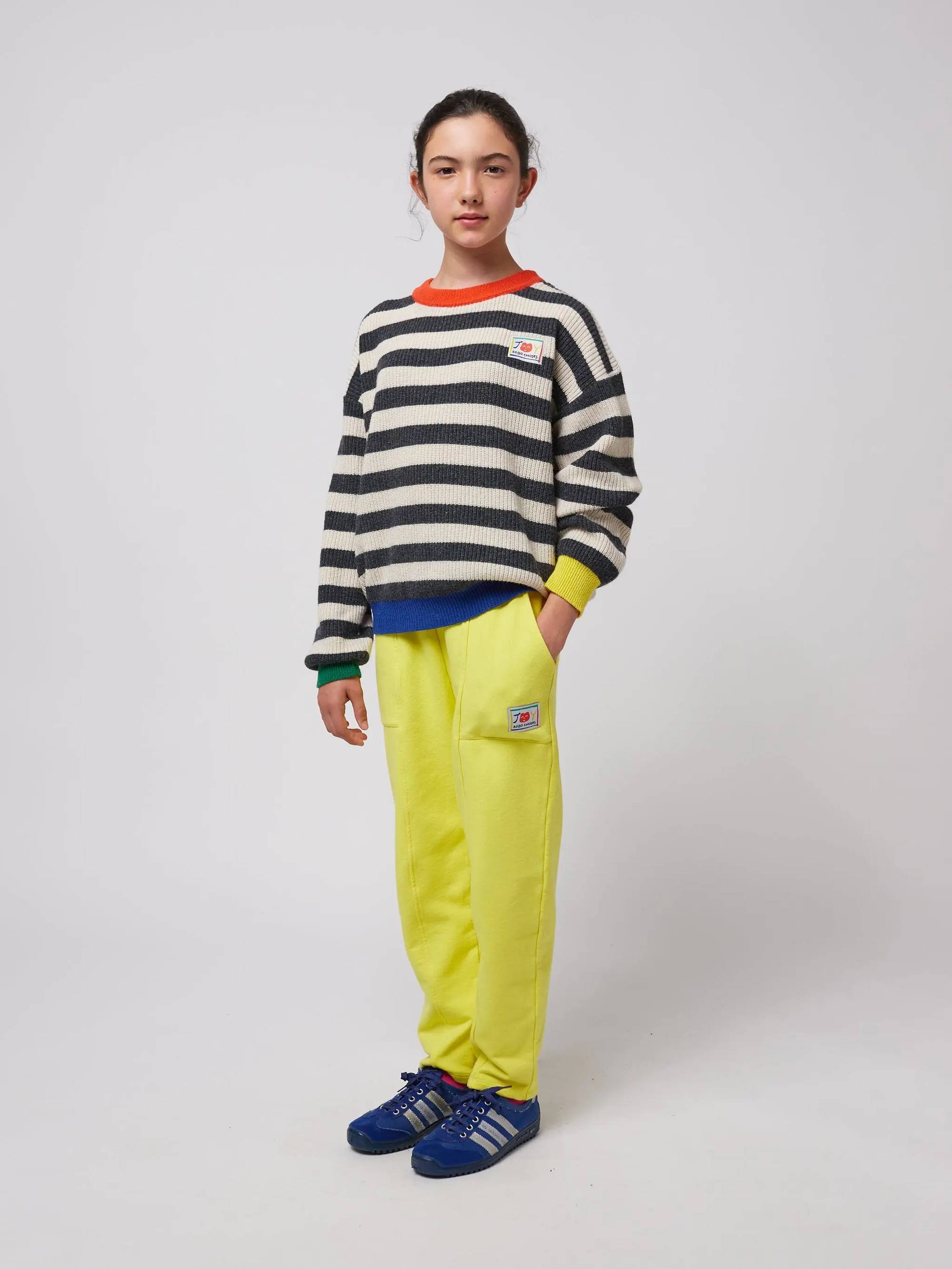 Smiling yellow jogging pants